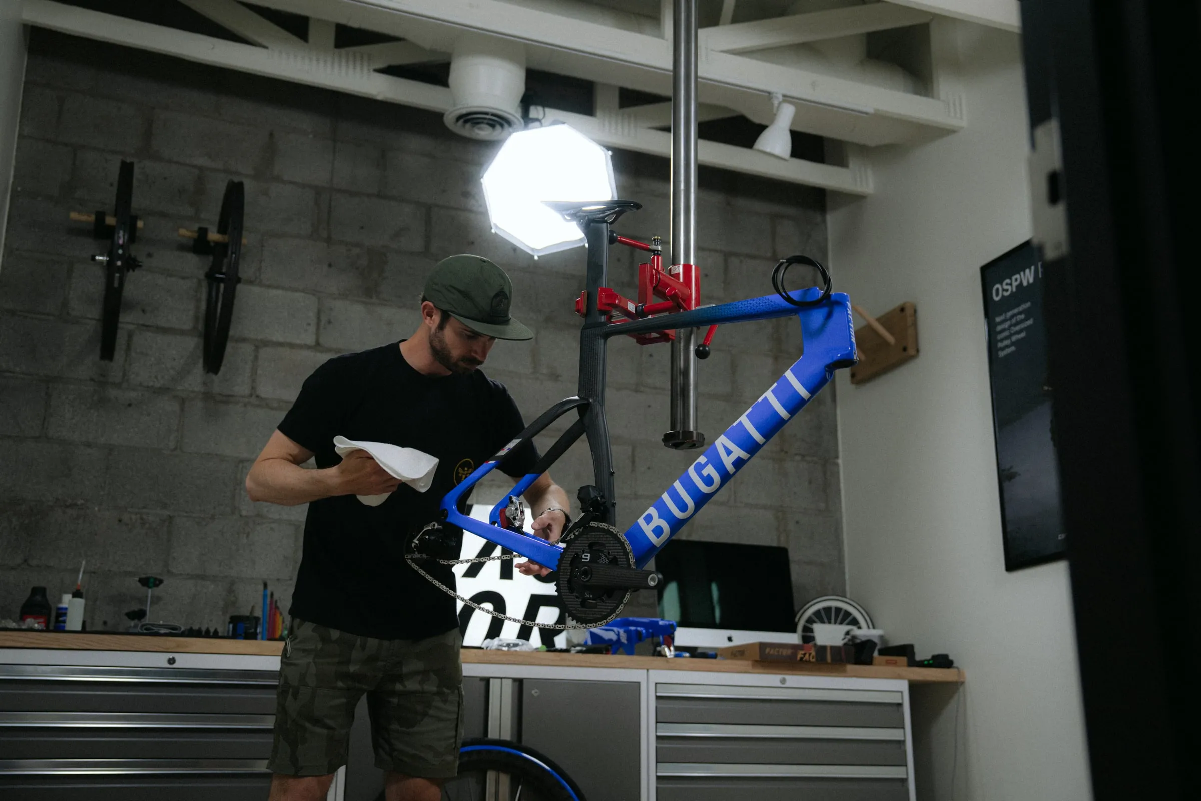 A Regroup mechanic building a custom road bike in the workshop.